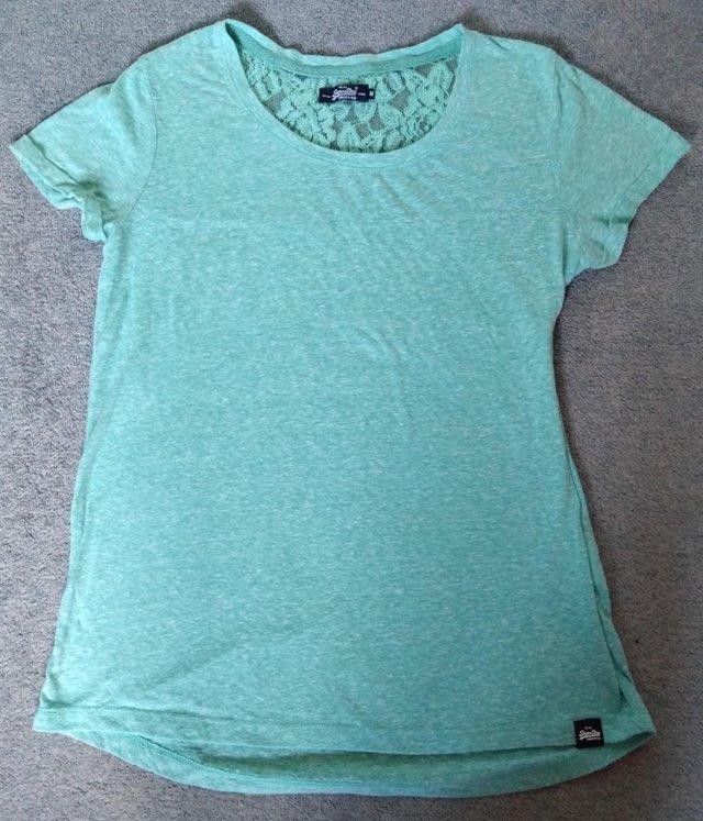 Preview of the first image of Superdry turquoise lace design short-sleeved t-shirt-size 12.