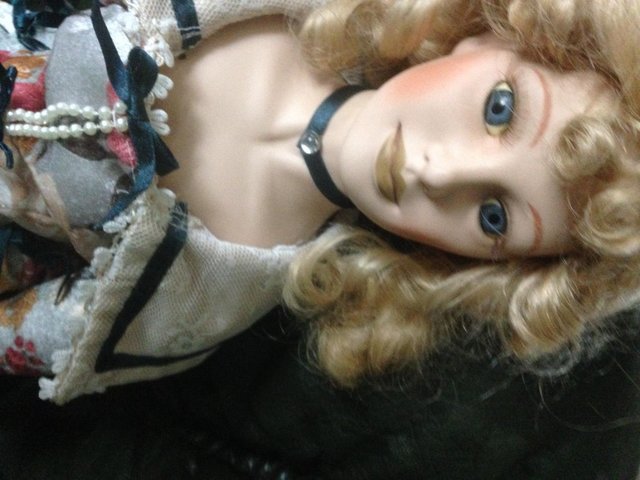 Preview of the first image of Vintage porcelain doll 24 inch. well dressed..