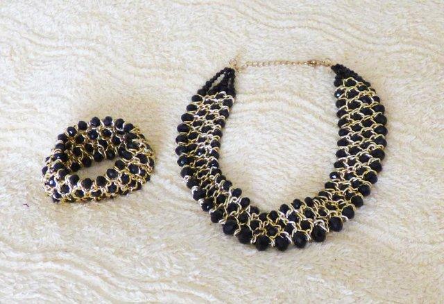 Preview of the first image of AS NEW SET OF BLACK-GOLD ENAMEL NECKLACE AND BRACELET.