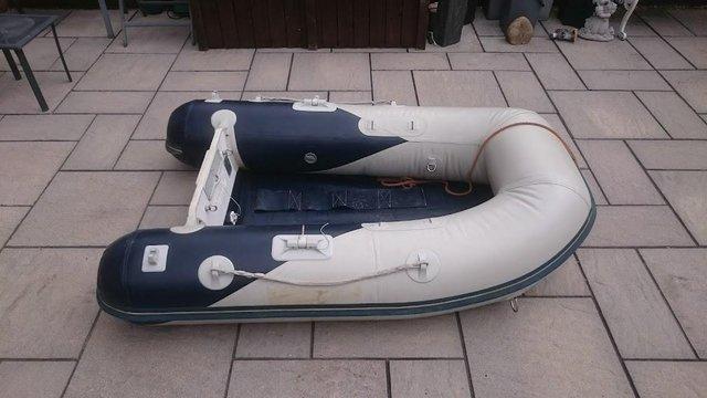 Preview of the first image of HONWAVE T202 INFLATABLE DINGHY SLAT FLOOR + YAMAHA OUTBOARD.