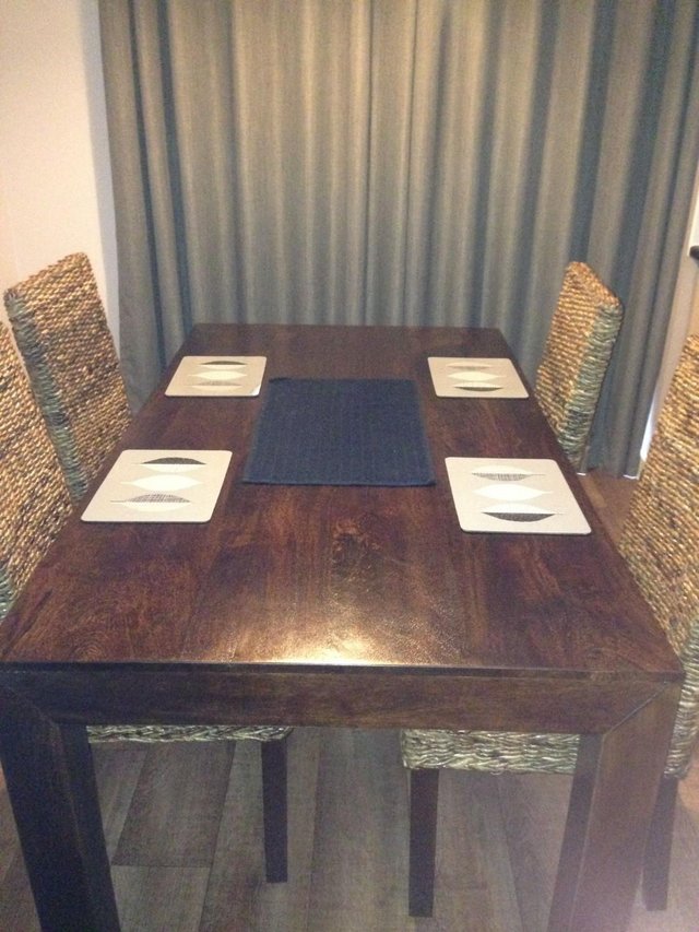 Preview of the first image of Dining table and Four chairs in VGC.