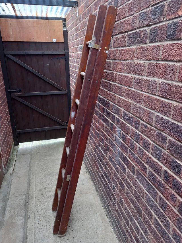 Preview of the first image of Wooden ladder extends to 12ft.