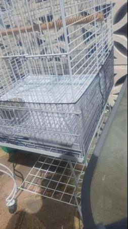 Image 12 of Large bird cage with stand , comes with perches , feeders