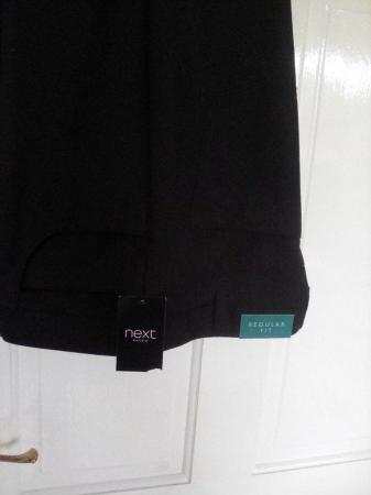 Image 1 of Men's black trousers never worn