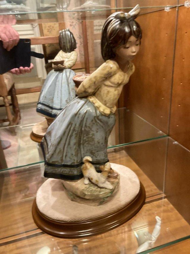 Preview of the first image of LLADRO Girl with dog and stand.
