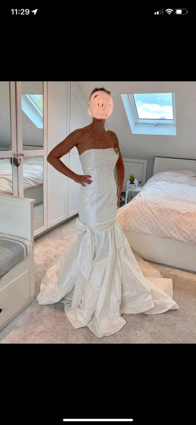 Preview of the first image of BNWT Mon Cheri Bridals wedding dress strapless, size 10.