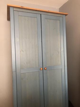 Image 1 of Wardrobe in washed blue and wood.