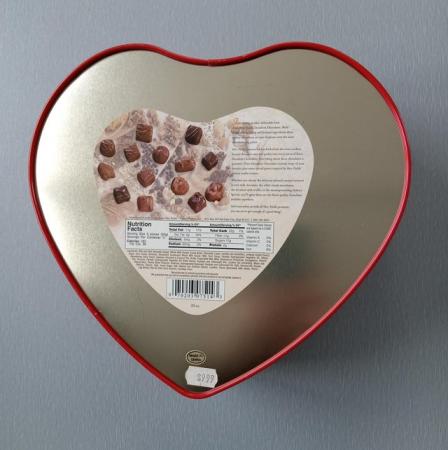 Image 3 of Red Heart Shaped Tin with Party Accessories.