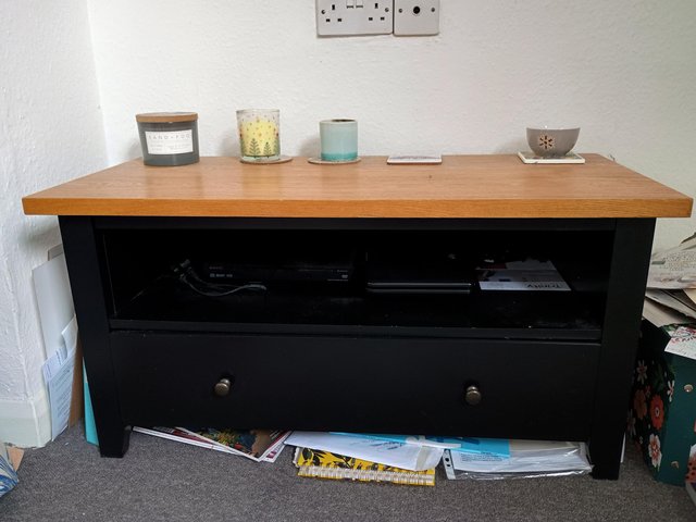 Preview of the first image of TV Stand - Black with a wooden top.