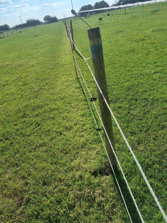 Preview of the first image of 26 Round Wooden fence posts and an extra large horse feed un.