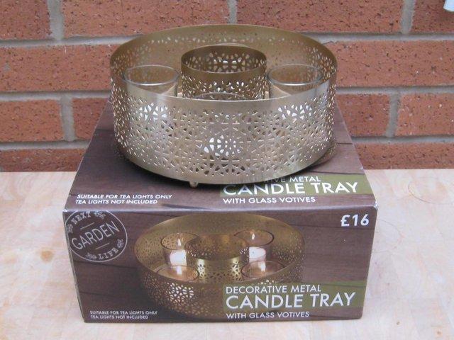 Preview of the first image of Candle tray in brass-effect metal.