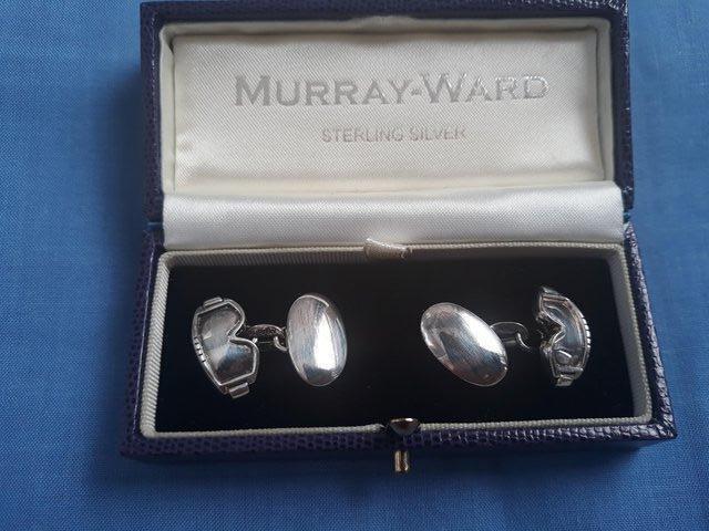 Preview of the first image of Murray wade sterling silver ski mask cufflinks.