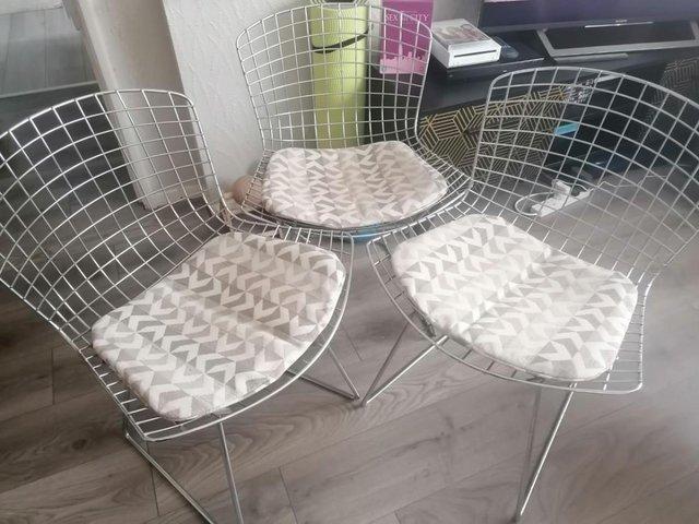 Preview of the first image of 3 STYLISH METAL CHAIRS WITH CUSHIONS USED.