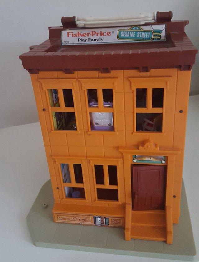 Preview of the first image of Vintage Fisher-Price Sesame Street family play house.