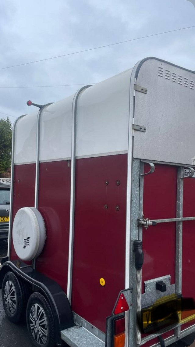 Preview of the first image of IFor Williams 510 striking burgundy and white horse trailer.