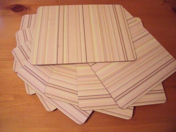 Image 1 of 8 muted yellow/oatmeal brown stripe cork-backed placemats.