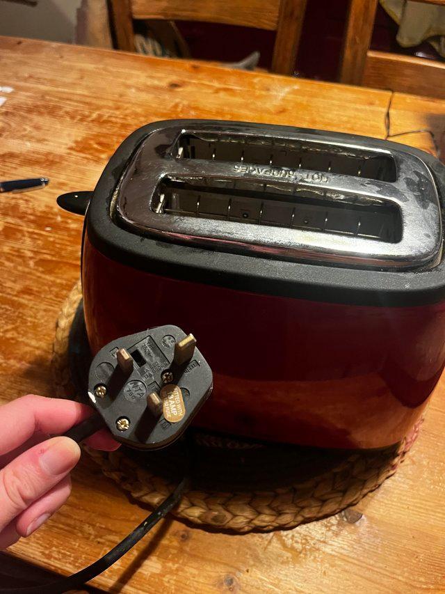 Preview of the first image of Red Russell Hobbs Toaster - Used but working order.