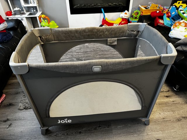 Preview of the first image of Joie Kubbie Sleep Travel Cot - Foggy Grey.