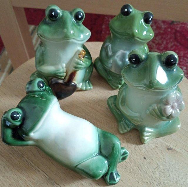 Preview of the first image of Set of 4 glazed frog ornaments.