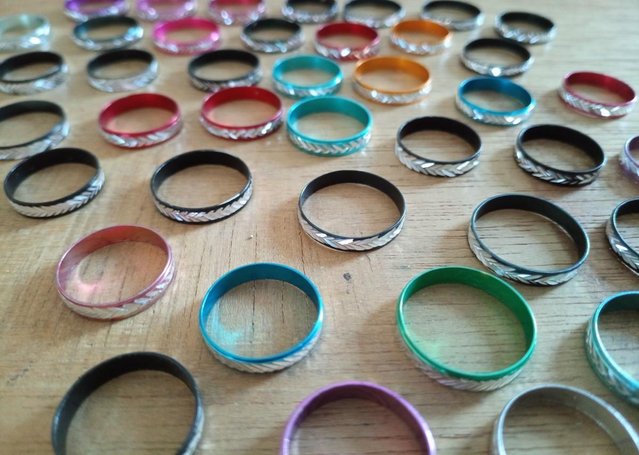 Preview of the first image of x50 multi coloured fashion rings -various sizes/colours.