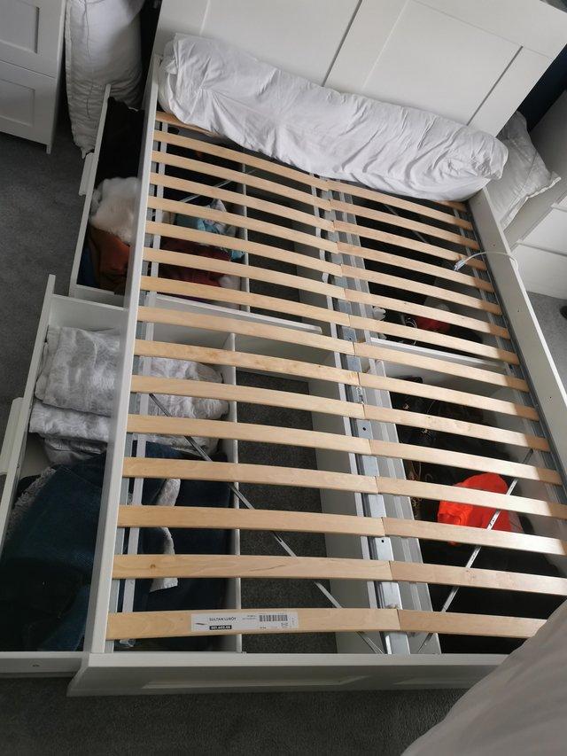 Preview of the first image of Ikea BRIMNES double storage bed and headboard.