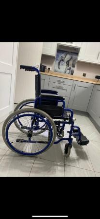 Image 3 of Child’s left leg elevated wheel chair like new