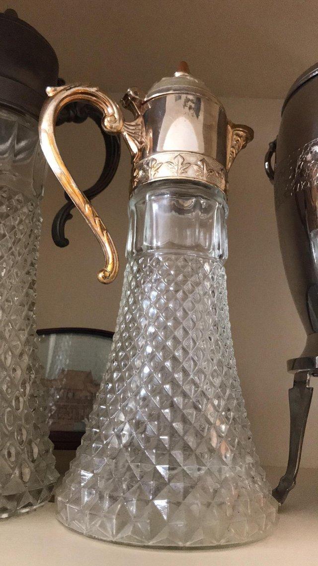 Preview of the first image of Vintage Pressed Glass Water Pitcher with Filigree Handle spo.