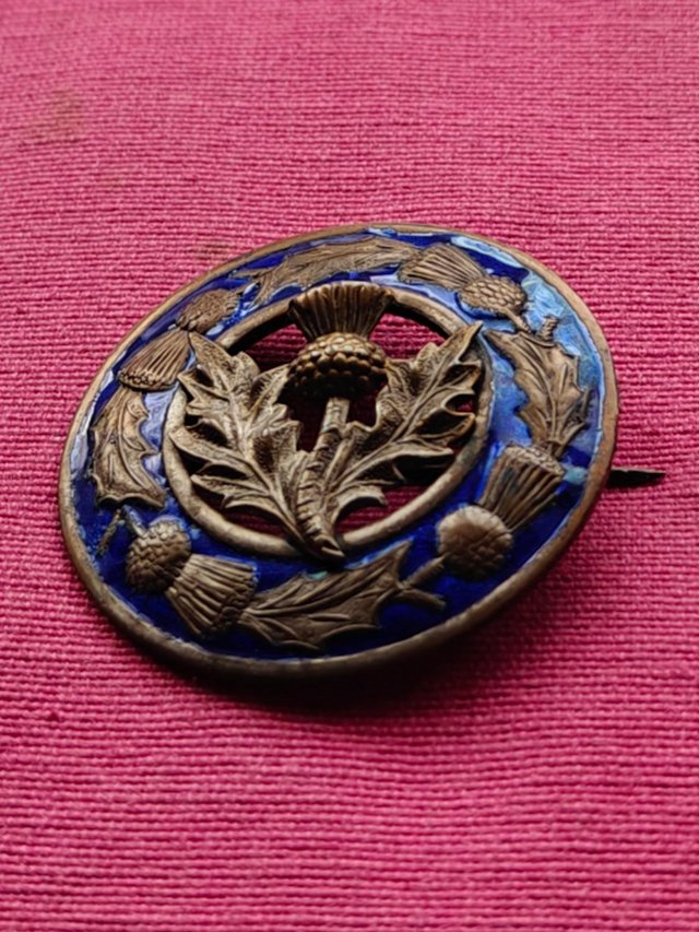 Preview of the first image of Vintage Scottish Copper Enamel Brooch.