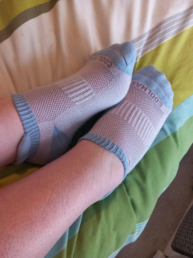 Preview of the first image of Ladies worn blue and white trainer socks.