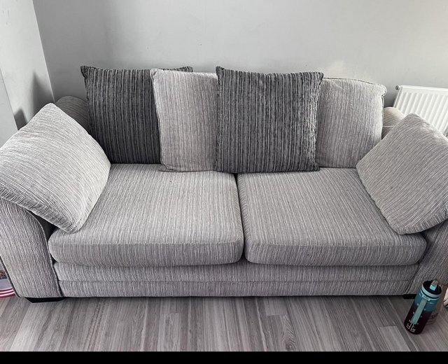 Preview of the first image of Large 3 seater sofa and matching foot stool.