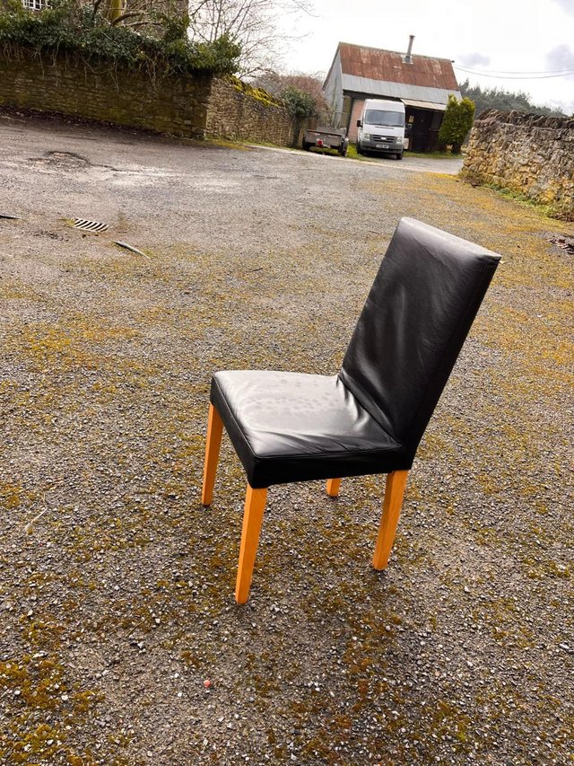 Preview of the first image of Black leatherette dining chairs.