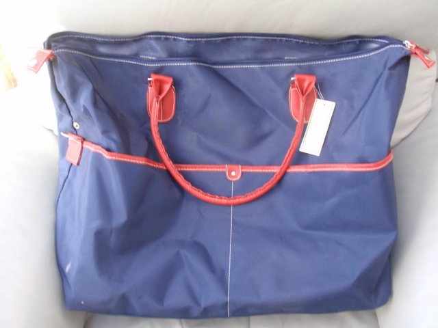 Preview of the first image of Brand New Navy Canvas Tommy and Kate Bag / Hold all.