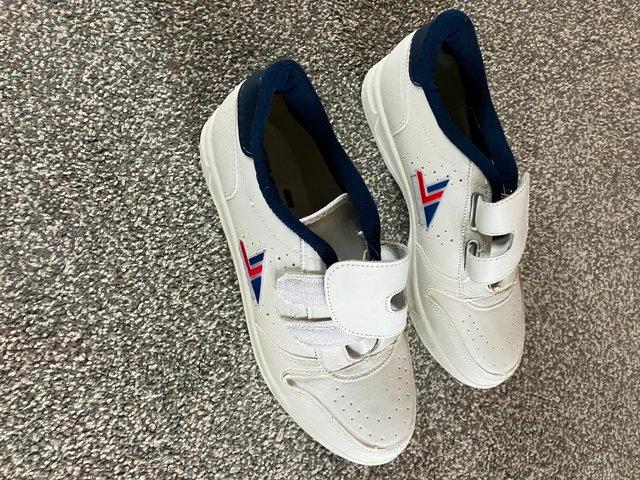 Preview of the first image of Men's White Trainers size 8 brand new.