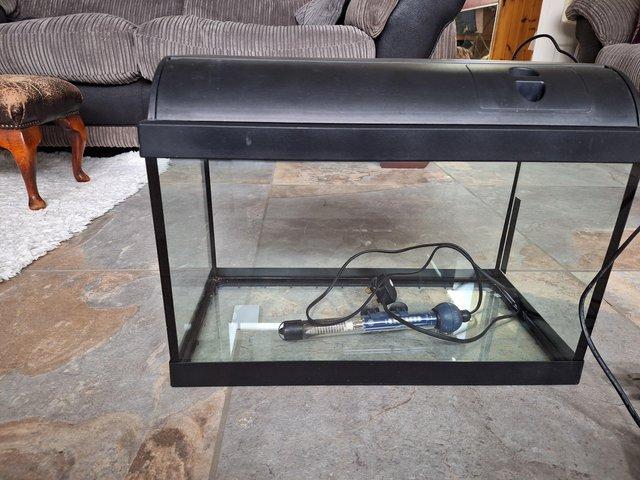 Preview of the first image of Small fish tank with heater and lighted lid.