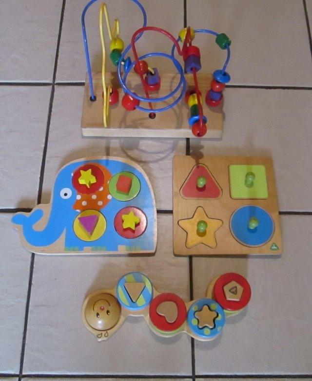 Preview of the first image of 4 assorted wooden Child's Toys.