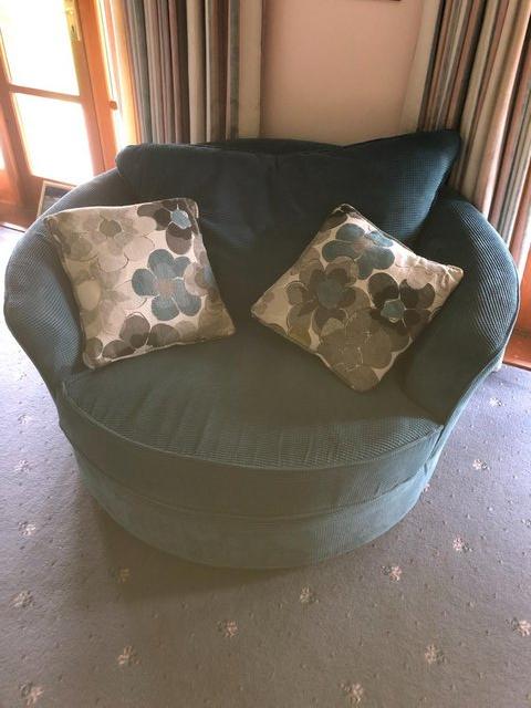 Preview of the first image of Large swivel chair with cushions, blue corduroy..