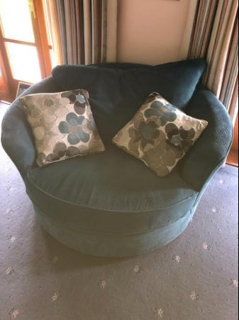 Image 1 of Large swivel chair with cushions, blue corduroy.
