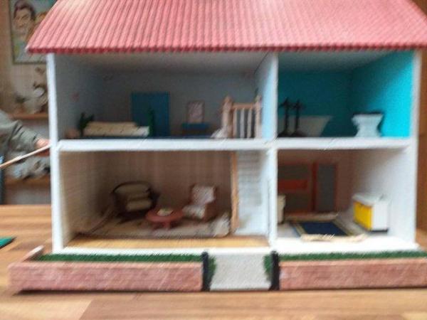 Image 2 of childs doll house 17inches h,14 inches w, 22inches long