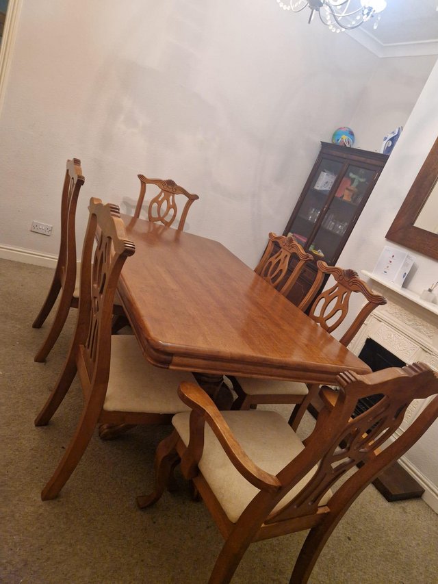 Preview of the first image of Wooden(mahagani) dinning table with 6 chairs.