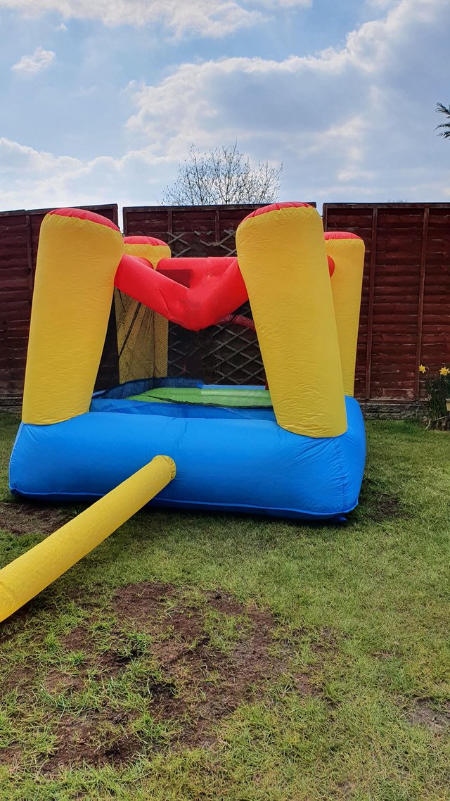 Preview of the first image of Bouncy castle and pump in full working order.