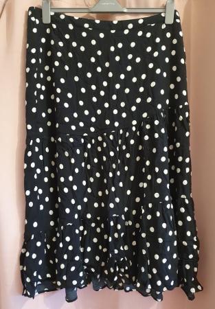 Image 1 of Women's black & white polka dot midi skirt, size 22.