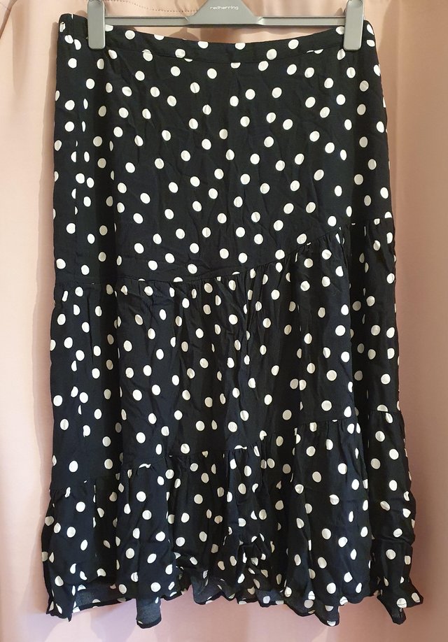 Preview of the first image of Women's black & white polka dot midi skirt, size 22..