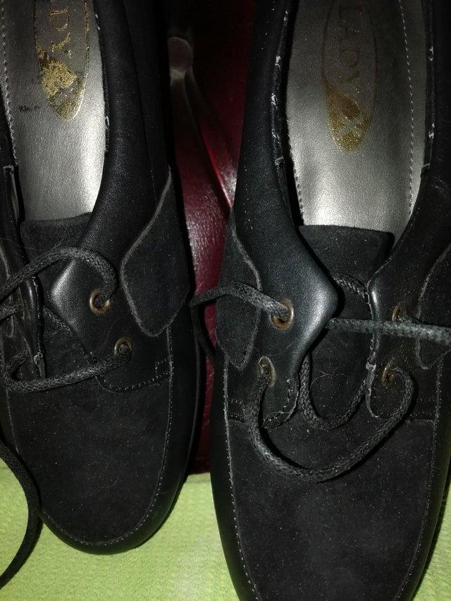 Preview of the first image of K skips black shoes with a small heel.