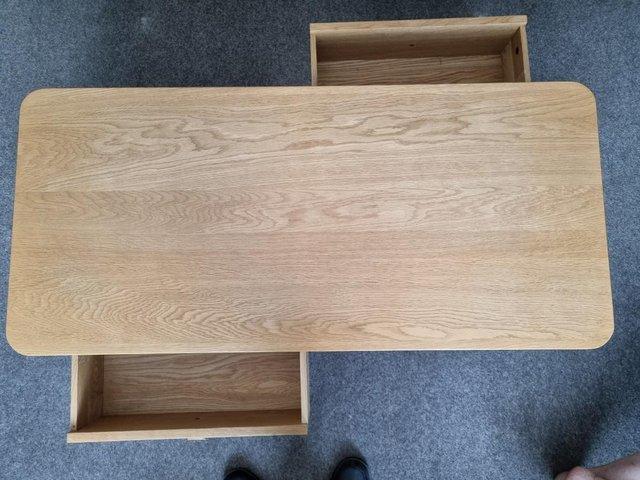 Preview of the first image of Ercol Teramo oak coffee table with 2 drawers.