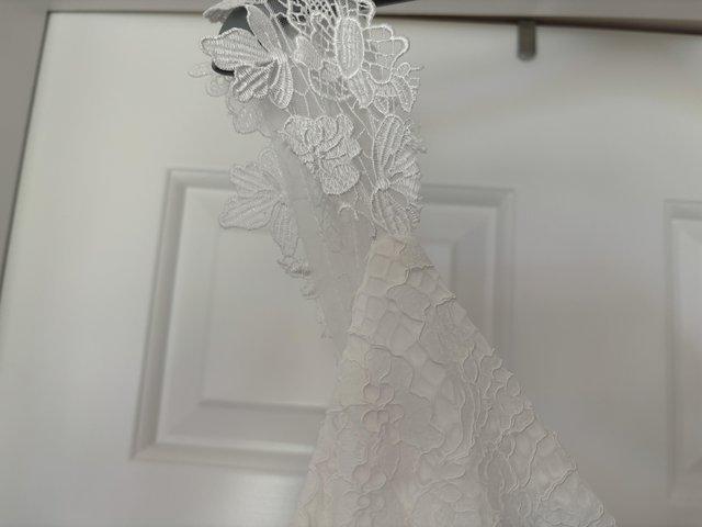 Preview of the first image of Modern wedding dress- size 14 BNWT.