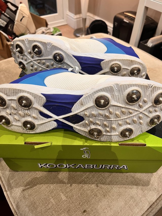 Preview of the first image of Kookaburra cricket trainers with spikes.