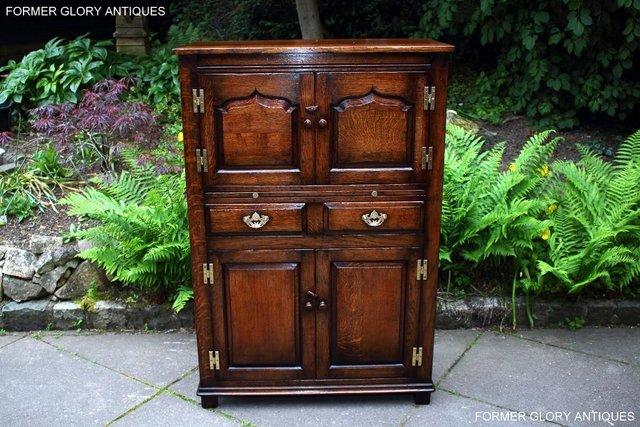 Preview of the first image of A TITCHMARSH AND GOODWIN OAK WINE CUPBOARD DRINKS CABINET.