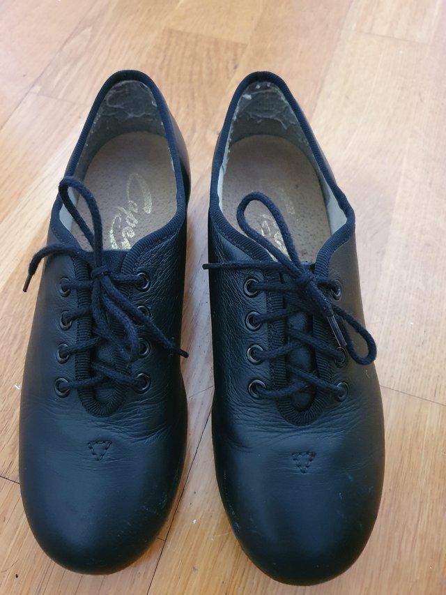 Preview of the first image of Capezio size 3/36 black Capezio tap shoes.