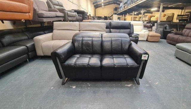 Preview of the first image of Ex-display Packham black leather 2 seater sofa.