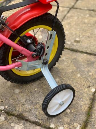 Image 3 of Child’s bike with new stabilisers.